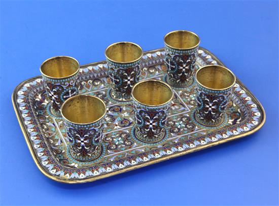 A late 19th century Russian 84 zolotnik silver gilt and cloisonne enamel liqueur set, gross 17 oz.